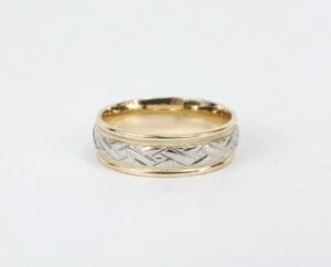 Gold and silver patterned wedding ring.
