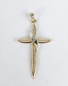 Gold cross pendant with silver accent.