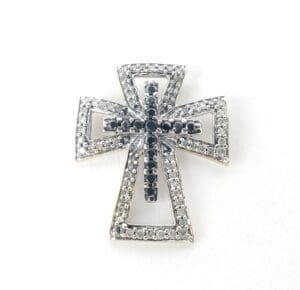 Silver and black jeweled cross pendant.