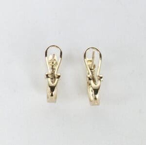 Gold hoop earrings with latch back closures.