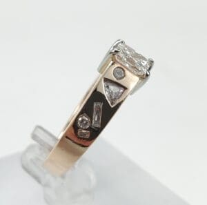 Gold ring with various shaped diamonds.