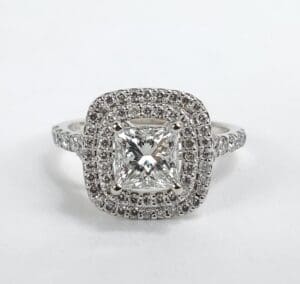 Diamond ring with square halo setting.