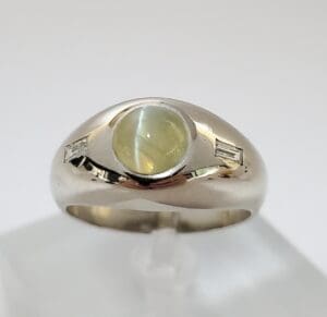 Silver ring with cat's eye gemstone.