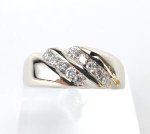 Gold ring with embedded sparkling diamonds.