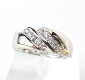 Silver ring with diamond accents.