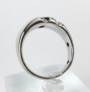 Silver ring with unique wavy design.