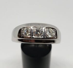 Silver ring with three sparkling diamonds.