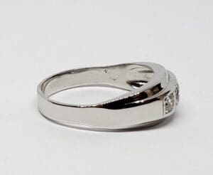 Silver ring with embedded gemstones.