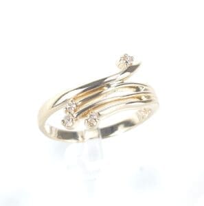 Gold ring with small diamond accents.