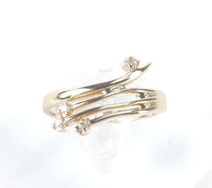 Gold ring with three small diamonds.