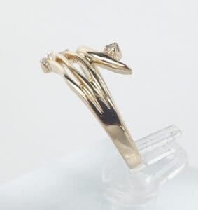 Gold ring with unique, flowing design.