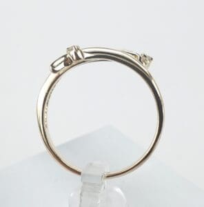 Gold ring with small diamond accents.