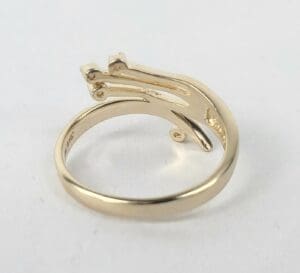 Gold ring with unique intertwined design.
