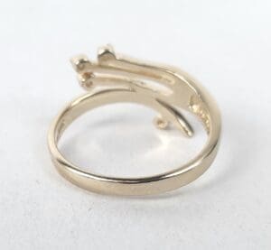 Gold ring with unique design details.