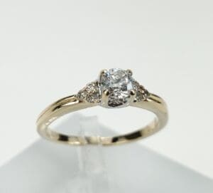 Gold ring with a diamond centerpiece.