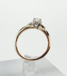 Gold ring with a diamond solitaire setting.