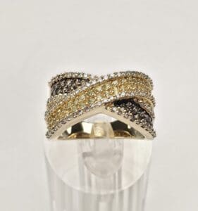 Gold and silver diamond-studded crossover ring.