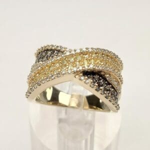 Multi-colored diamond crossover band ring.