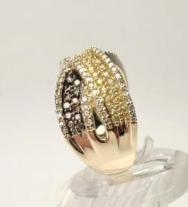 Gold ring with multicolored diamond rows.