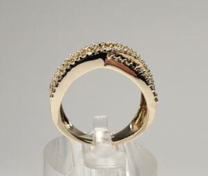 Gold ring with diamond accents on display.