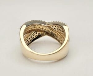 Gold ring with intricate overlapping design.