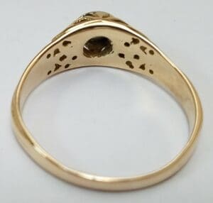 Gold ring with intricate inner design.