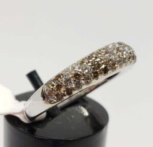 Silver ring with brown and white stones.