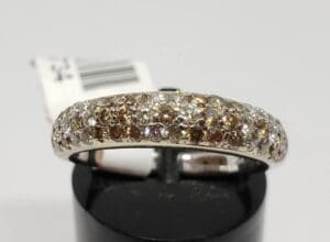 Diamond ring with brown and white stones.