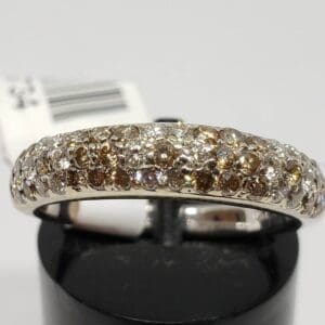 Diamond ring with brown and white stones.