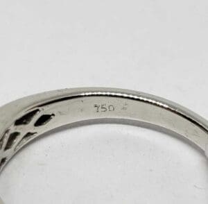 Ring with "750" engraving on inner band.