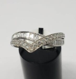 Silver ring with sparkling diamond accents.