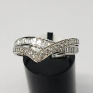 Silver ring with sparkling diamond accents.