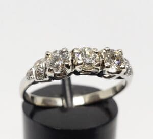 Silver ring with three sparkling diamonds.