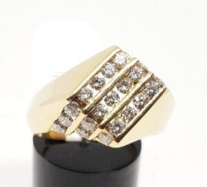 Gold ring with multiple diamond rows.