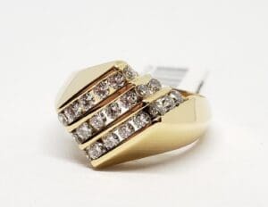 Gold ring with multiple diamond rows.