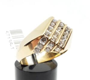 Gold ring with diamond accents on display.