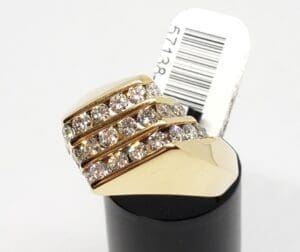 Gold ring with multiple diamond rows.