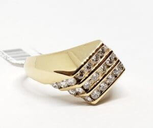 Gold ring with three rows of diamonds.