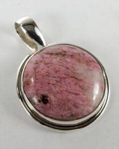 Pink stone pendant with silver setting.