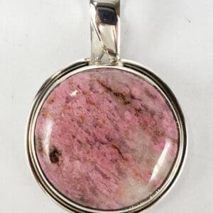 Pink stone pendant with silver setting.