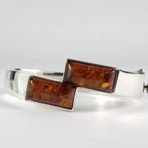 Silver bracelet with rectangular amber stones.
