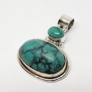Turquoise pendant with silver setting.