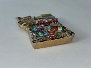 Colorful magnet with various city landmarks.