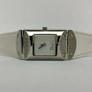 Silver watch with white leather strap.