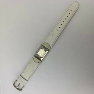 White leather strap with silver buckle.