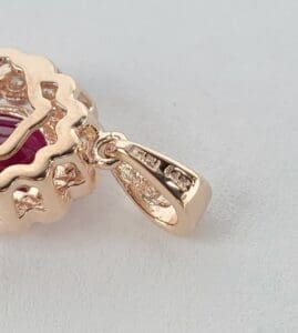 Gold pendant with intricate detailing.