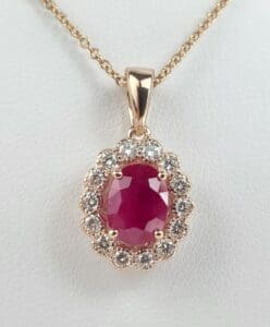 Gold necklace with ruby and diamonds pendant.
