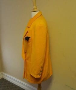Yellow jacket on mannequin with pocket square.