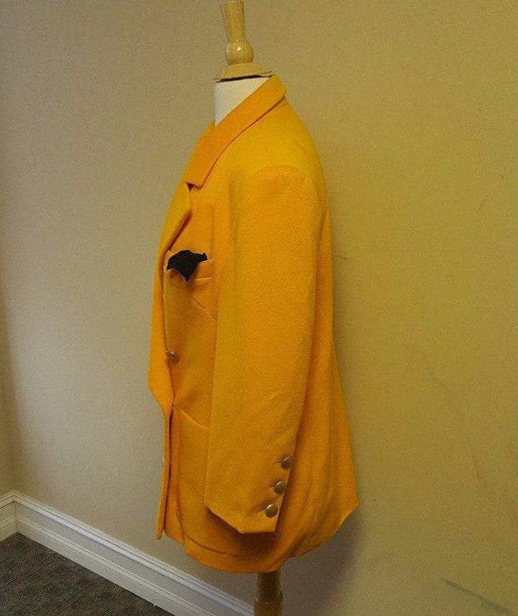 Yellow jacket on mannequin with pocket square.