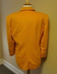 Yellow jacket displayed on a mannequin.
